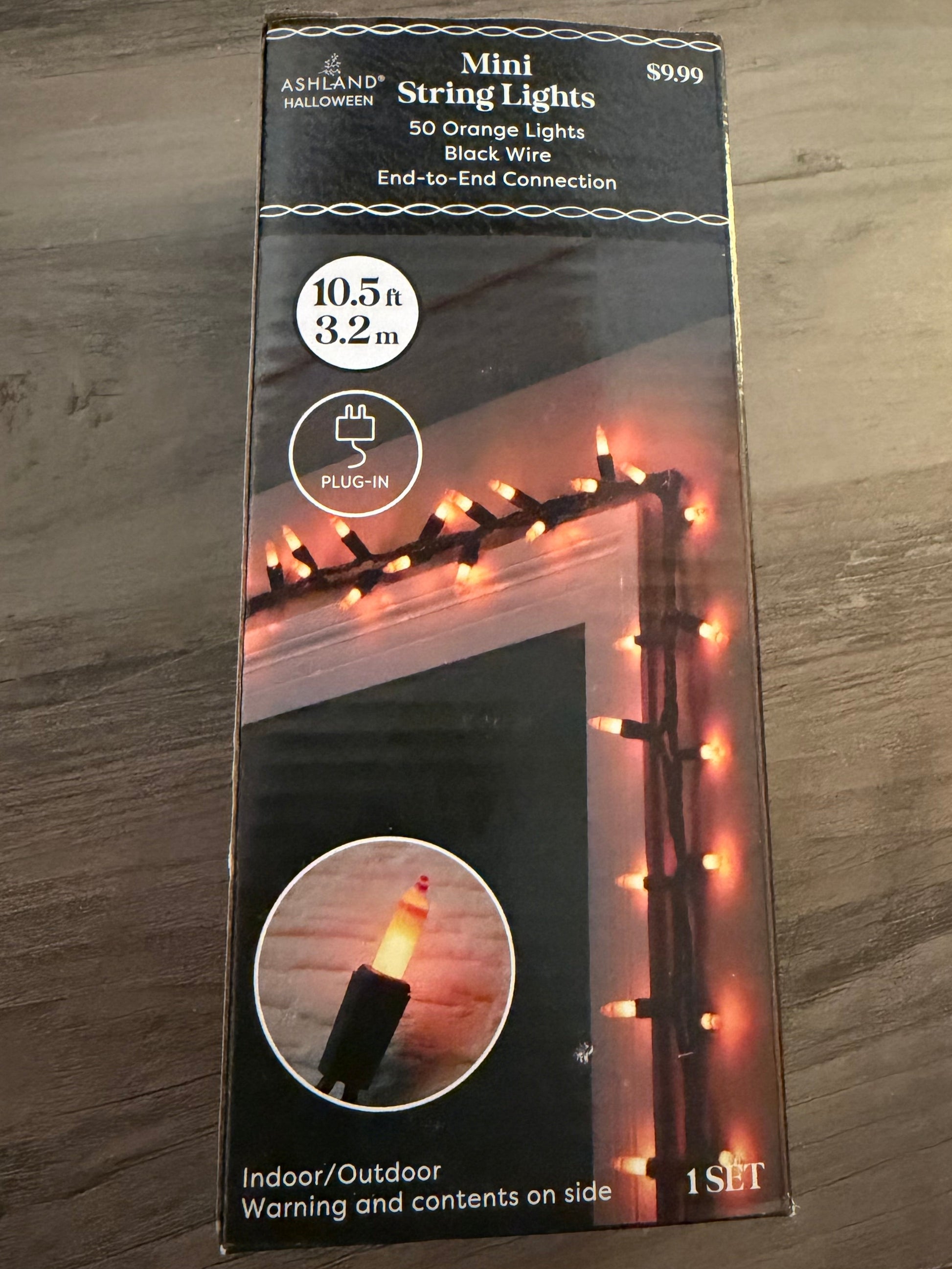 Packaging of string lights on a wooden surface