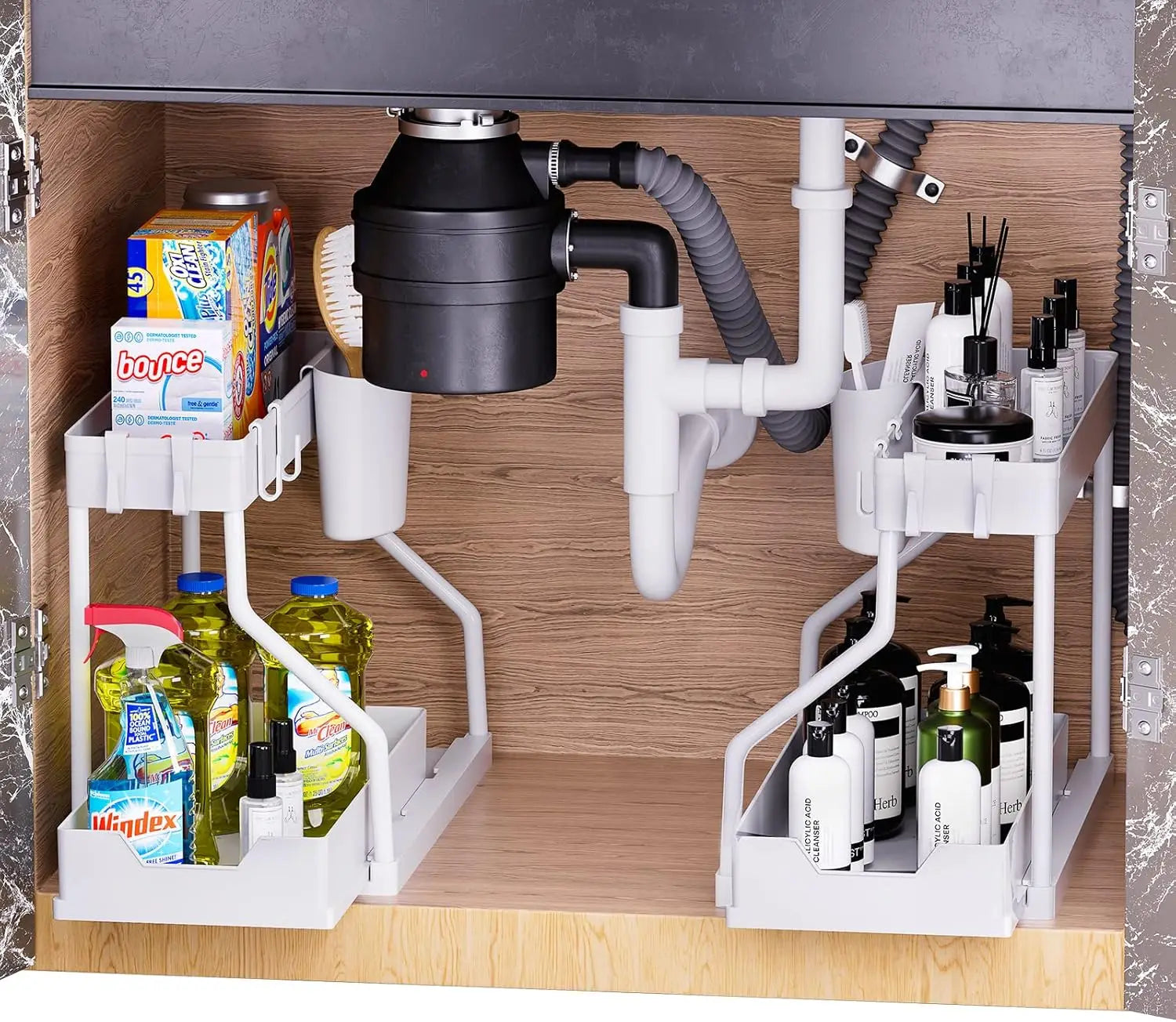 Under-sink organization system with storage racks and plumbing components.