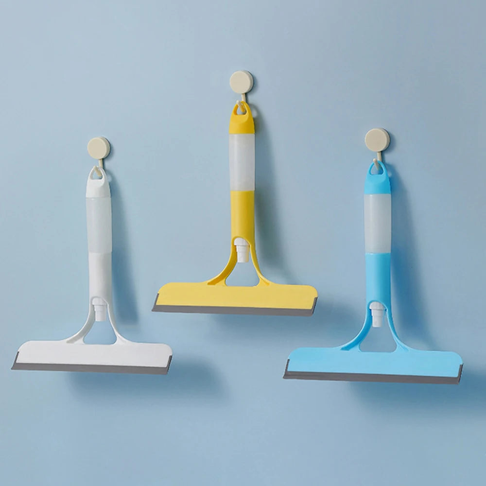 Three squeegees in white, yellow, and blue on a light blue background