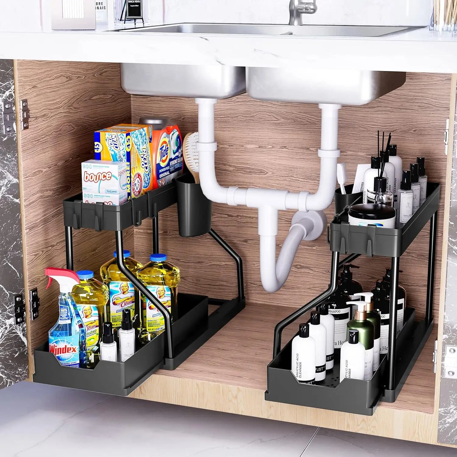 Under-sink organizer with cleaning supplies and toiletries in a kitchen.