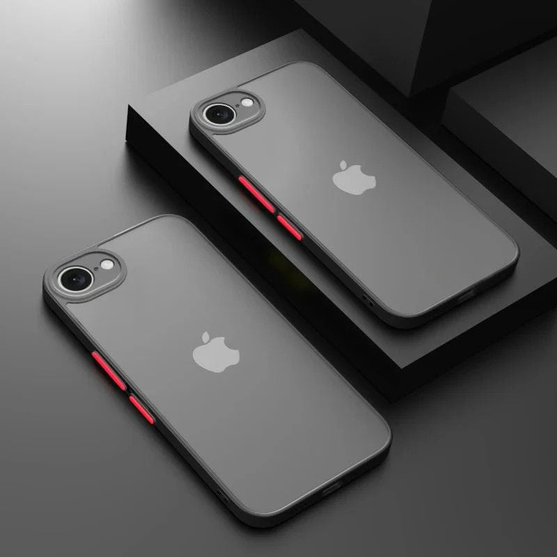 Two black phone cases with red accents on a dark surface